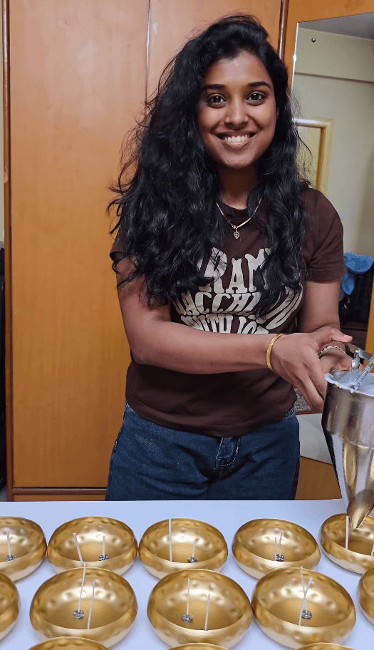 Hands crafting an Elyska coconut shell candle
